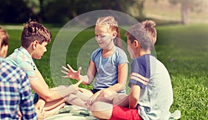 Happy kids playing rock-paper-scissors game