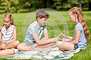 Happy kids playing rock-paper-scissors game