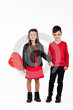 Happy kids with red heart balloon