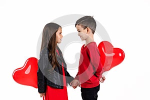 Happy kids with red heart balloon