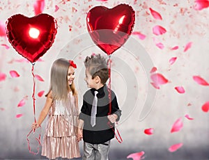 Happy kids with red heart balloon