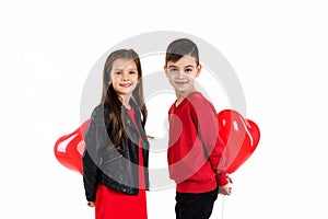 Happy kids with red heart balloon