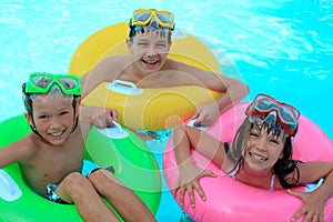 Happy kids in swimming pool