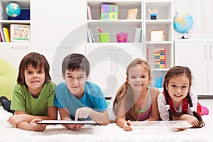 Happy kids with tablet computers