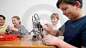 Happy kids using building kit.