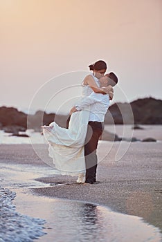 Happy kissing groom and bride