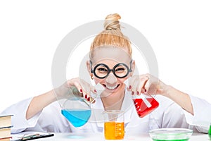 Happy lab assistant mixes fluids in a laboratory