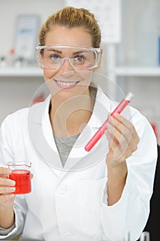 Happy lab technician in science laboratory class