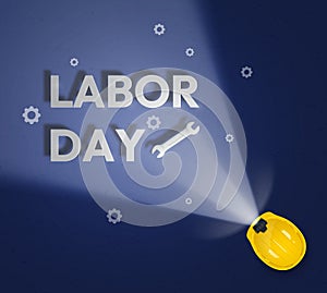 Happy Labor Day banner illuminated with construction helmet with lantern.