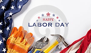 Happy Labor day concept. American flag with different construction tools on white background, with copy space for text