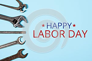 Happy labor day concept. Banner with Different wrenches on blue background