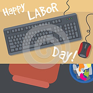 Happy Labor Day, with a table, keyboard, mouse and bin. View from top