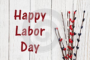 Happy Labor Day text with red, white and blue berry spray