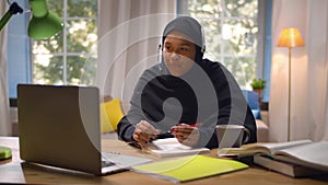 Happy lady in black hijab studying internet distance education on computer app. Realtime