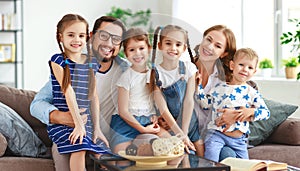Happy large family mother father and children   at home photo