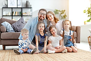 Happy large family mother father and children   at home photo