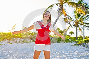 Happy latin beautiful girl in caribbean beach