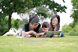 Happy latino family reading book