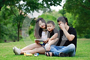 Happy latino family reading book