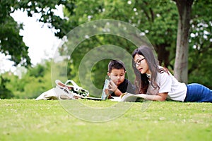 Happy latino family reading book