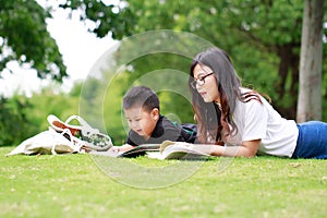 Happy latino family reading book