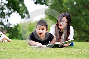 Happy latino family reading book