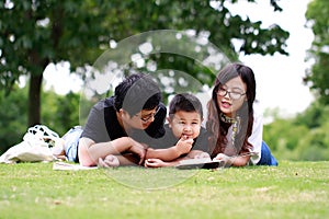 Happy latino family reading book