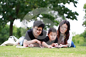 Happy latino family reading book