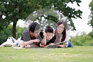 Happy latino family reading book