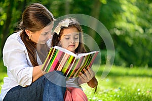 Happy latino family reading book