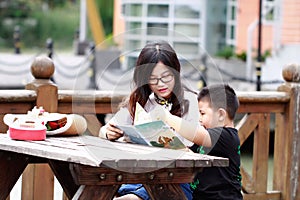 Happy latino family reading book