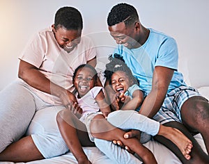 Happy, laugh and black family on a bed with games, tickle and bonding in a home on the weekend. Love, playing and