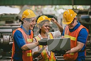 happy laugh engineer man and woman team enjoy working together talking using laptop computer