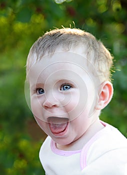 Happy laughing baby outdoor