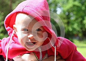 Happy laughing baby outdoors