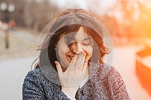 Happy laughing beautiful large woman.