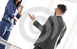 Happy laughing businesswoman sharing a joke with a colleague