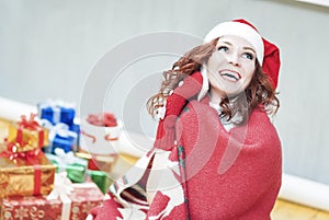 Happy and Laughing Caucasian Santa Girl with Lots of Presents Be