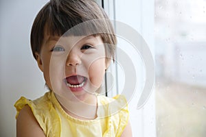 Happy laughing funny face little girl portrait. happy smiling child