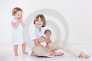 Happy laughing kids in white room with white clothes
