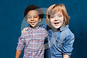 Happy laughing multiracial friends schoolboys. photo