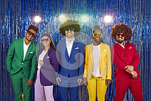 Happy laughing people in sunglasses in gangnam style on blue shiny background with lights.
