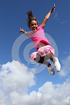 Happy leap of joy great success for young girl