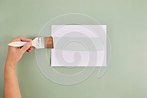 Happy Left Hander& x27;s Day. Left hand hold brush and writing text. photo