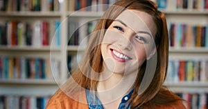 Happy, library and face of woman in bookstore for reading, research and knowledge in university. Student, college campus