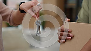 Happy life partners having apartment keys after buying first home