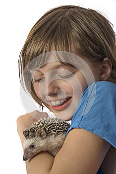 Happy litle girl with African pygmy hedgehog