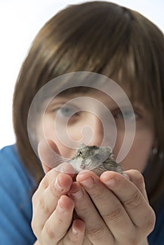 A happy litle girl with a cute hamster