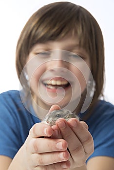 A happy litle girl with a cute hamster