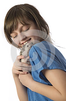 Happy litle girl with her pet African pygmy hedgehog